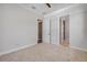 This bedroom offers plush carpet and access to a bathroom and walk-in closet, providing convenience and functionality at 212 Due East St, New Smyrna Beach, FL 32169