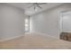 This bedroom features plush carpet and a door leading to a private balcony, perfect for enjoying the outdoors at 212 Due East St, New Smyrna Beach, FL 32169