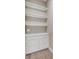 Custom closet with white shelving and drawers provides storage space at 212 Due East St, New Smyrna Beach, FL 32169