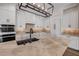 Spacious kitchen with stainless appliances, white cabinets, a marble countertop island, and modern pendant lighting at 212 Due East St, New Smyrna Beach, FL 32169