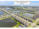 Beautiful aerial view of the Venetian Bay community, clubhouse, and surrounding golf course at 220 Venetian Palms Blvd, New Smyrna Beach, FL 32168