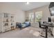 Well-lit bedroom with desk, chair, and built in shelving perfect for studying at 220 Venetian Palms Blvd, New Smyrna Beach, FL 32168