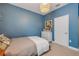 Bedroom features an accent wall, pendant light and carpet floors at 220 Venetian Palms Blvd, New Smyrna Beach, FL 32168