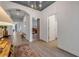 Bright hallway with tile floors, leading to various rooms in the house at 220 Venetian Palms Blvd, New Smyrna Beach, FL 32168