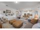 Open-concept living room flows into the kitchen, creating a spacious and inviting area for relaxing and entertaining at 220 Venetian Palms Blvd, New Smyrna Beach, FL 32168