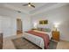Serene main bedroom with tray ceilings, two windows, and matching night stands at 220 Venetian Palms Blvd, New Smyrna Beach, FL 32168