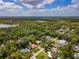 Aerial view of the home, surrounded by lakes and lush greenery at 2236 Davis Dr, New Smyrna Beach, FL 32168