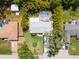 An aerial view shows the property's layout, featuring a pool, bamboo border, and spacious lawn at 2236 Davis Dr, New Smyrna Beach, FL 32168
