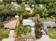 Aerial view of property with a pool, lush landscaping, and a long driveway at 2236 Davis Dr, New Smyrna Beach, FL 32168