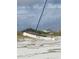 Catamaran resting on the sand near local shops at 2236 Davis Dr, New Smyrna Beach, FL 32168