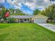 Charming home with well manicured lawn, two-car garage, and beautiful landscaping at 2236 Davis Dr, New Smyrna Beach, FL 32168