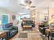 Open concept living room and kitchen with wood floors and modern decor at 2236 Davis Dr, New Smyrna Beach, FL 32168