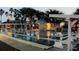 An inviting view of the shuffleboard courts with benches and a covered area at dusk at 2236 Davis Dr, New Smyrna Beach, FL 32168
