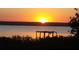 Beautiful sunset view with colorful sky overlooking the water and greenery at 2236 Davis Dr, New Smyrna Beach, FL 32168