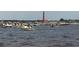 Boats out on the water with the historic Ponce de Leon Inlet Lighthouse in the background at 2236 Davis Dr, New Smyrna Beach, FL 32168