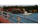 Picturesque waterfront view with boat, restaurant, and waterway; accessible by bridge at 2236 Davis Dr, New Smyrna Beach, FL 32168