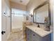 Bathroom featuring custom vanity, mirror, and tiled floors at 2656 Old Smyrna Trl, New Smyrna Beach, FL 32168