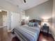 Relaxing bedroom with modern colors, hard wood floor, lamp, and built in storage at 2656 Old Smyrna Trl, New Smyrna Beach, FL 32168