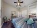 Relaxing bedroom with modern colors, hard wood floor, desk, and natural lighting at 2656 Old Smyrna Trl, New Smyrna Beach, FL 32168