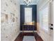 Unique entryway with decorative wall, wood floors, and elegant lighting fixture at 2656 Old Smyrna Trl, New Smyrna Beach, FL 32168