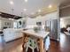 Open kitchen with a large island and modern appliances; great for entertaining at 2656 Old Smyrna Trl, New Smyrna Beach, FL 32168