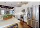 Beautiful kitchen featuring white cabinets, stainless steel appliances, and a marble-topped island at 2656 Old Smyrna Trl, New Smyrna Beach, FL 32168