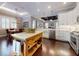 Bright and airy kitchen with an island and stainless steel appliances at 2656 Old Smyrna Trl, New Smyrna Beach, FL 32168