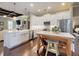 Bright kitchen with white cabinetry, island, and stainless steel appliances at 2656 Old Smyrna Trl, New Smyrna Beach, FL 32168
