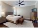Well-lit main bedroom featuring hardwood floors, ceiling fan, and traditional decor at 2656 Old Smyrna Trl, New Smyrna Beach, FL 32168