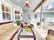 Covered patio with ceiling fan, and comfortable wicker furniture set at 2656 Old Smyrna Trl, New Smyrna Beach, FL 32168