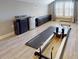 Bright workout space featuring large windows, gray floors, and pilates workout equipment at 2656 Old Smyrna Trl, New Smyrna Beach, FL 32168