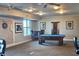 Spacious billiard room with a pool table, comfortable seating, and ample lighting for entertainment at 2801 S Ridgewood Ave # 512, South Daytona, FL 32119