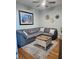 Comfortable living room featuring a gray sectional sofa, modern rug, and stylish decor at 2801 S Ridgewood Ave # 512, South Daytona, FL 32119