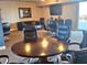 Comfortable meeting room offering plush rolling chairs, a sofa, and a large screen TV at 2801 S Ridgewood Ave # 512, South Daytona, FL 32119