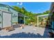 Backyard area featuring a gravel yard with small structure for growing plants at 2914 Sabal Palm Dr, Edgewater, FL 32141