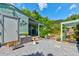 Backyard garden with an outdoor seating area and a lush landscape design at 2914 Sabal Palm Dr, Edgewater, FL 32141