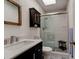 Bathroom featuring walk-in shower, modern vanity, toilet, and skylight for natural lighting at 2914 Sabal Palm Dr, Edgewater, FL 32141