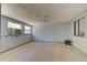 Bonus room featuring tile flooring, natural light, ceiling fan, and wall AC unit at 2914 Sabal Palm Dr, Edgewater, FL 32141
