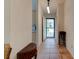 Inviting entryway with tile flooring, neutral walls, and stylish decor at 2914 Sabal Palm Dr, Edgewater, FL 32141