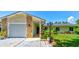 Charming single-story home featuring a stone accent wall, well-manicured lawn, and inviting curb appeal at 2914 Sabal Palm Dr, Edgewater, FL 32141