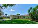 Inviting single-story home with well-maintained landscaping, stone accents, and an attached single-car garage at 2914 Sabal Palm Dr, Edgewater, FL 32141