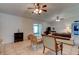 Open-concept living room with tile flooring, neutral walls, and natural light at 2914 Sabal Palm Dr, Edgewater, FL 32141