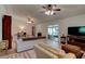 Spacious living room with tile flooring, ceiling fans and sliding door access to outdoor patio at 2914 Sabal Palm Dr, Edgewater, FL 32141