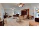 Spacious living room with tile flooring, ceiling fans, and large windows at 2914 Sabal Palm Dr, Edgewater, FL 32141