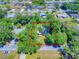 Aerial view of a home surrounded by greenery, outlining the property's borders within a wooded area at 3013 Lime Tree Dr, Edgewater, FL 32141