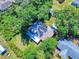 A serene view of a cozy home surrounded by verdant trees and neat landscaping from above at 3013 Lime Tree Dr, Edgewater, FL 32141