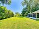 Wide open backyard featuring an expansive lawn, perfect for activities and enjoying the outdoors at 3013 Lime Tree Dr, Edgewater, FL 32141