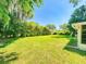 Spacious backyard with healthy green grass and privacy offering quiet enjoyment of the outdoors at 3013 Lime Tree Dr, Edgewater, FL 32141