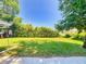 Backyard with lush lawn and trimmed hedges, offering a peaceful outdoor setting at 3013 Lime Tree Dr, Edgewater, FL 32141