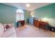 Bedroom with carpet, ceiling fan, and lots of sunlight from the large arched window at 3013 Lime Tree Dr, Edgewater, FL 32141